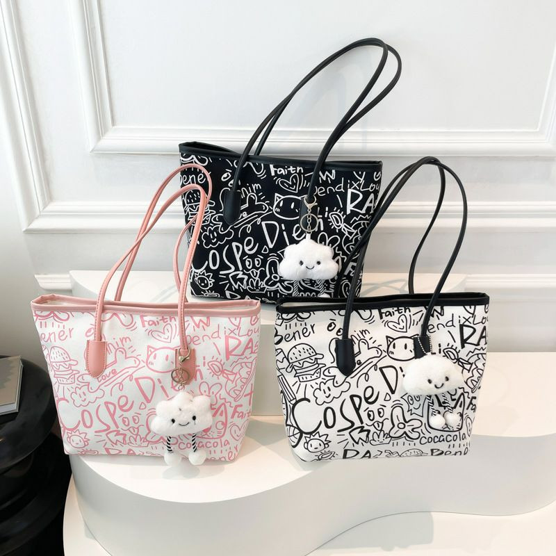 Nouveau Sac fourre-tout à main graffiti design de niche pour femmes. sac à bandoulière décontracté, sac à aisselles de grande capacité