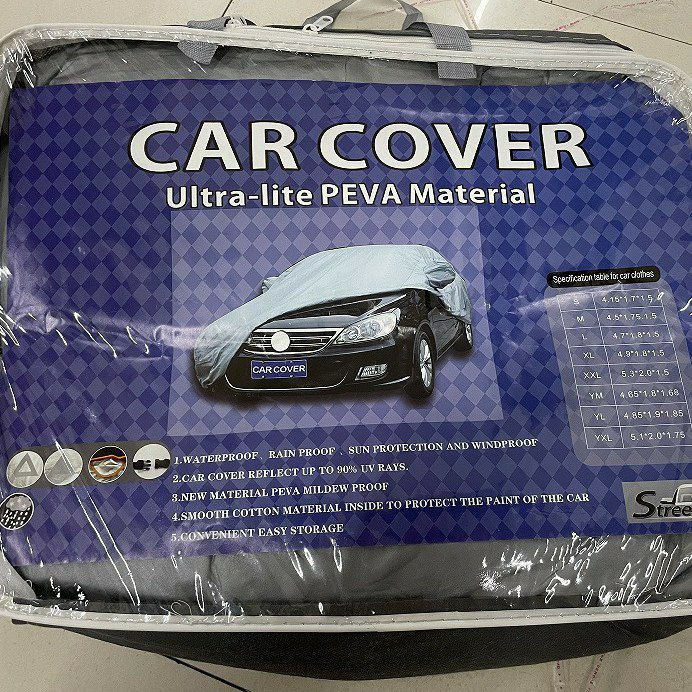 Housse de protection pour voiture en matériau PEVA ultra-léger.